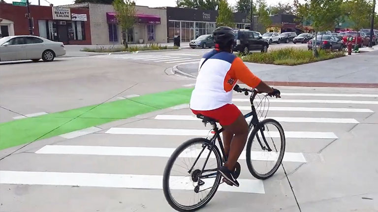 biker crossing the street